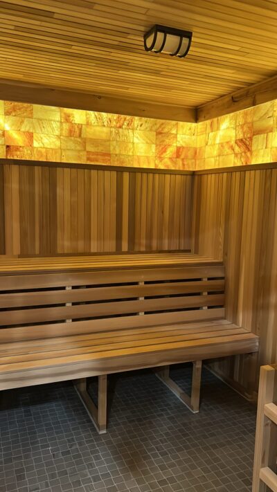 sauna interior with bench and himalayan salt wall